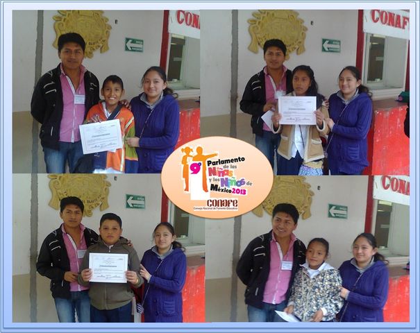 Cuatro niños participantes en el 9º parlamento infantil 2013
